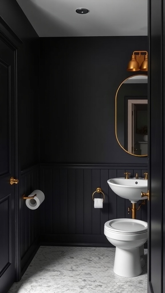 A small bathroom with black walls, gold fixtures, and a white sink and toilet.