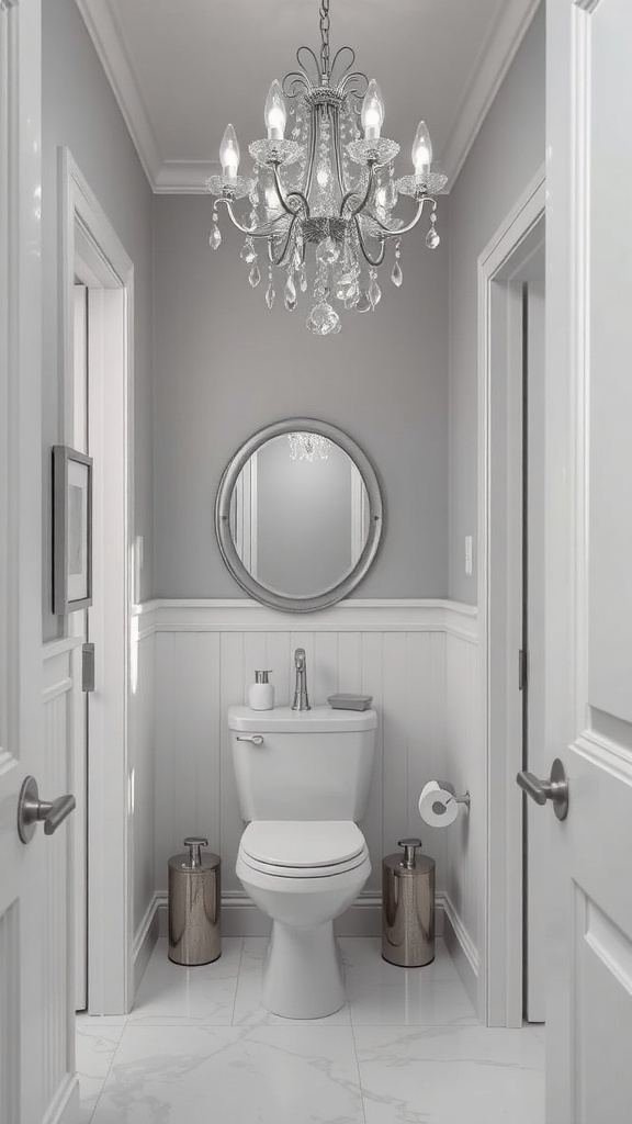 A small bathroom featuring soft gray walls, a chandelier, and metallic accents.